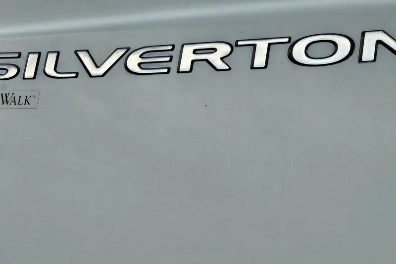 Slide: The Image of Silverton 35 Motor Yacht 2003 logo on boat exterior. - 33