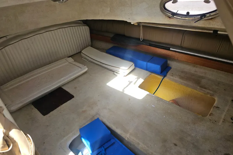 Slide: The Image of Interior cabin of 2007 Glacier Bay 2670 Isle Runner boat, featuring seating and storage areas. - 21