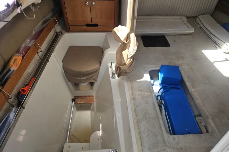 Slide: The Image of Interior of a 2007 Glacier Bay 2670 Isle Runner boat, featuring storage and seating areas. - 19