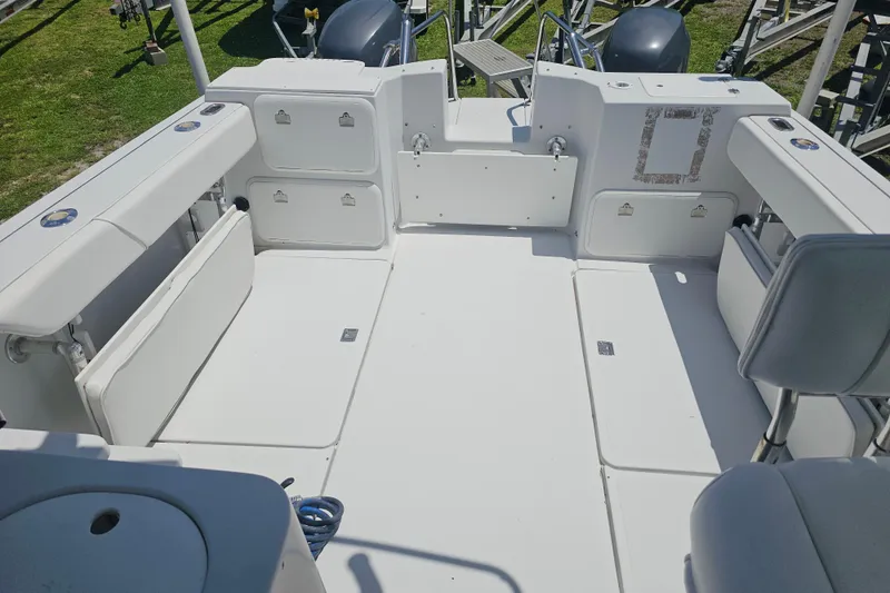 Slide: The Image of 2007 Glacier Bay 2670 Isle Runner boat interior with seating and storage compartments. - 14