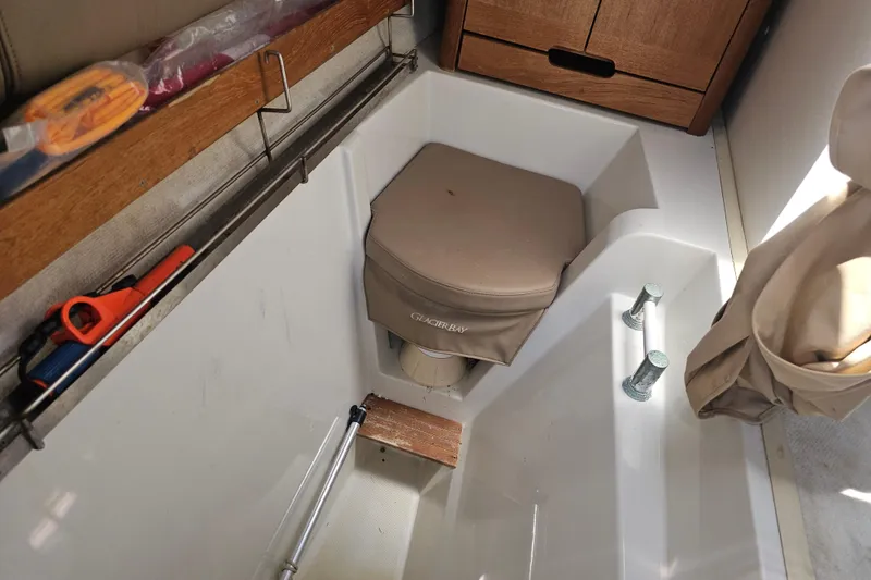 Slide: The Image of Interior of 2007 Glacier Bay 2670 Isle Runner boat with storage and seating area. - 20
