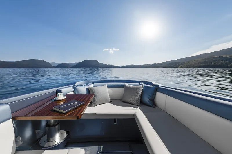 Slide: The Image of Luxurious Riva El-Iseo 2004 boat interior with scenic lake and mountain view. - 12