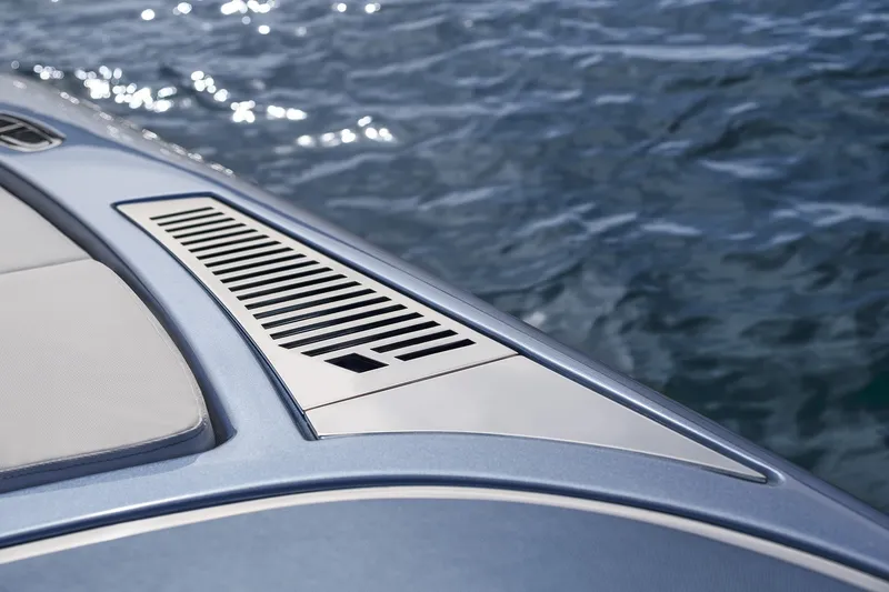 Slide: The Image of Close-up of 2004 Riva El-Iseo boat deck with sleek design and water background. - 13