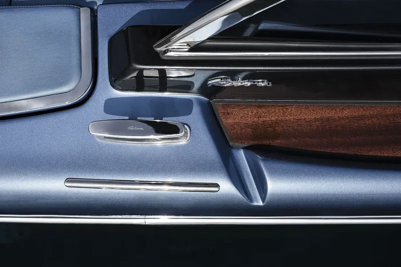 Slide: The Image of Close-up of 2004 Riva El-Iseo boat detailing, featuring sleek design and wood accents. - 16