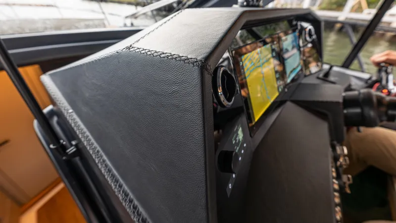 Slide: The Image of Hanover 415 boat console, 2026 model, featuring modern navigation instruments. - 24