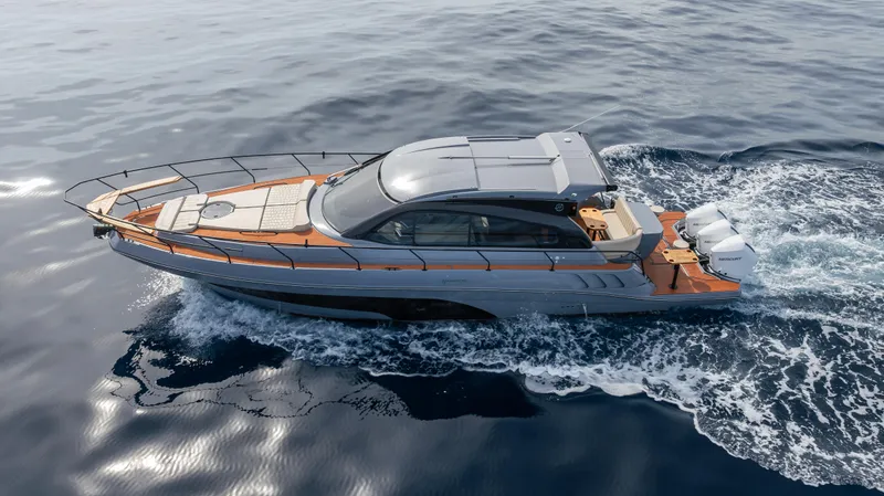 Slide: The Image of Luxurious 2025 Hanover 415 yacht cruising on open water. - 2