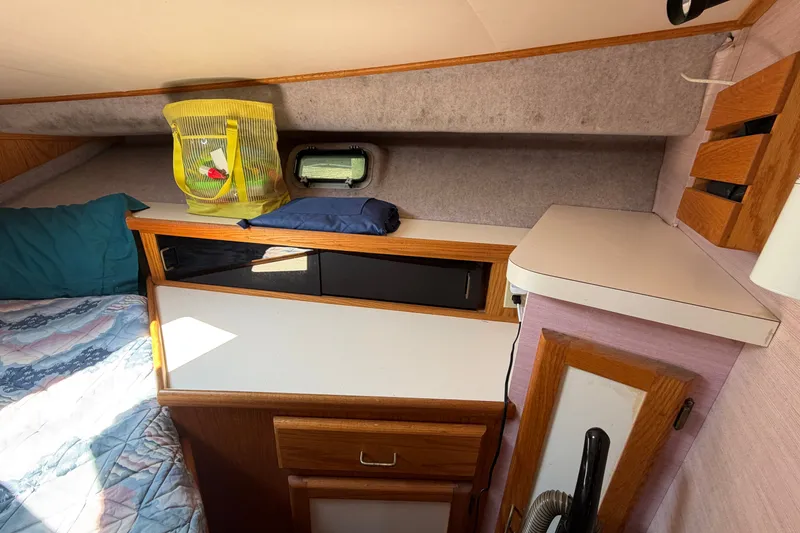 Slide: The Image of Interior cabin of 1987 Silverton 34 Convertible boat with bed and storage. - 31