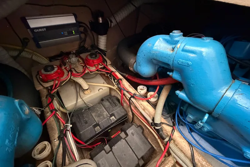 Slide: The Image of Engine compartment of a 1987 Silverton 34 Convertible with wiring and components visible. - 43