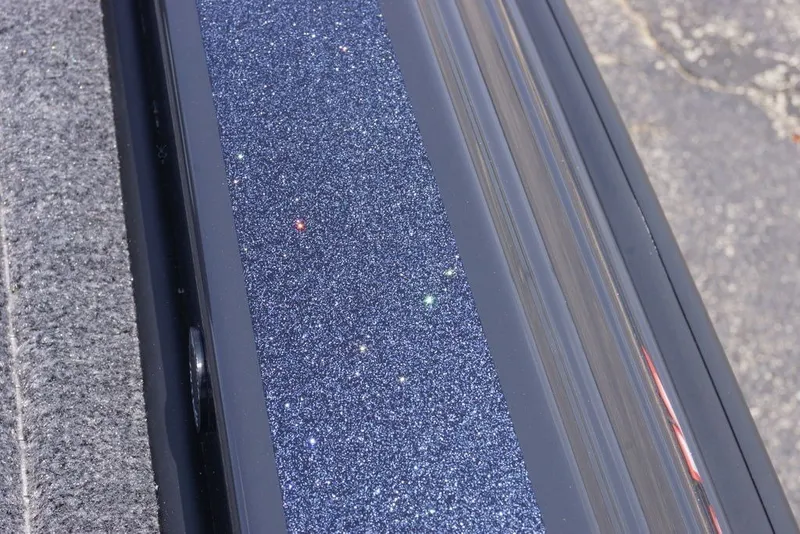 Slide: The Image of Close-up of 2027 Phoenix 921 Elite X glittery surface detail. - 13
