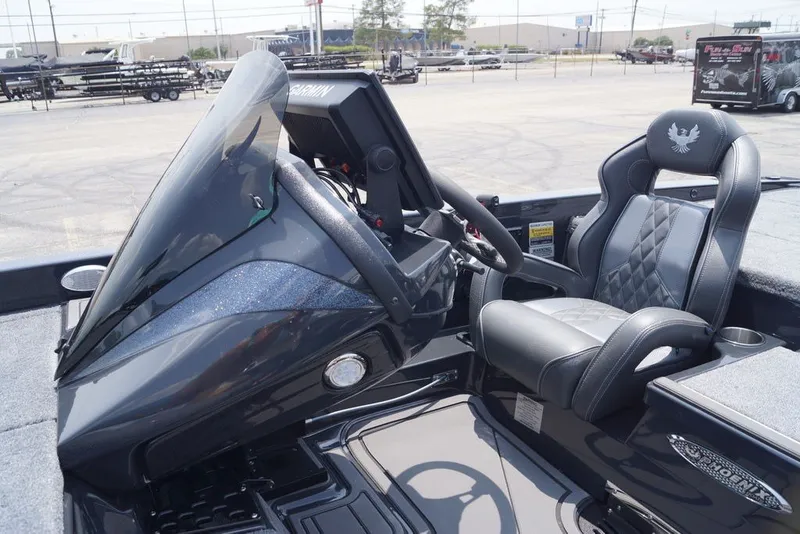 Slide: The Image of 2027 Phoenix 921 Elite X boat interior with sleek dashboard and luxurious seating. - 19