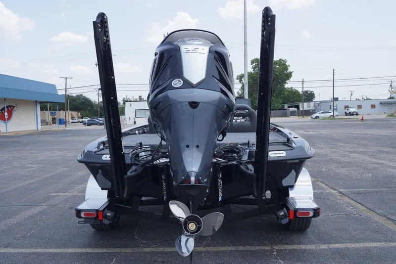Slide: The Image of Rear view of a 2027 Phoenix 921 Elite X boat with powerful outboard motor. - 4