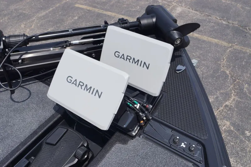 Slide: The Image of Dual Garmin displays on a 2027 Phoenix 921 Elite X boat dashboard. - 23