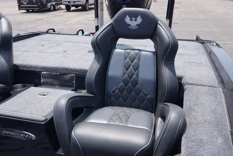Slide: The Image of Luxurious seating in the 2027 Phoenix 921 Elite X boat, featuring diamond-stitched upholstery. - 17