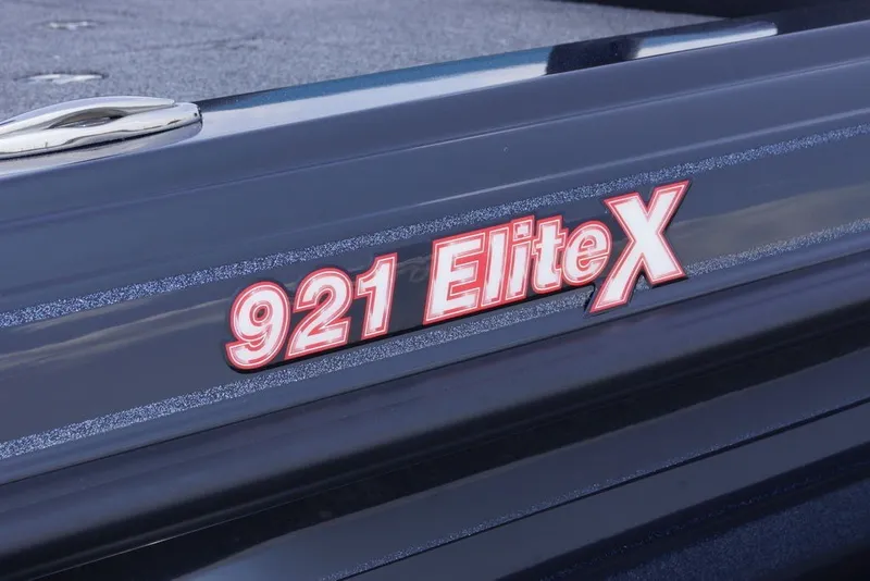 Slide: The Image of Close-up of 2027 Phoenix 921 Elite X boat model logo on sleek surface. - 10