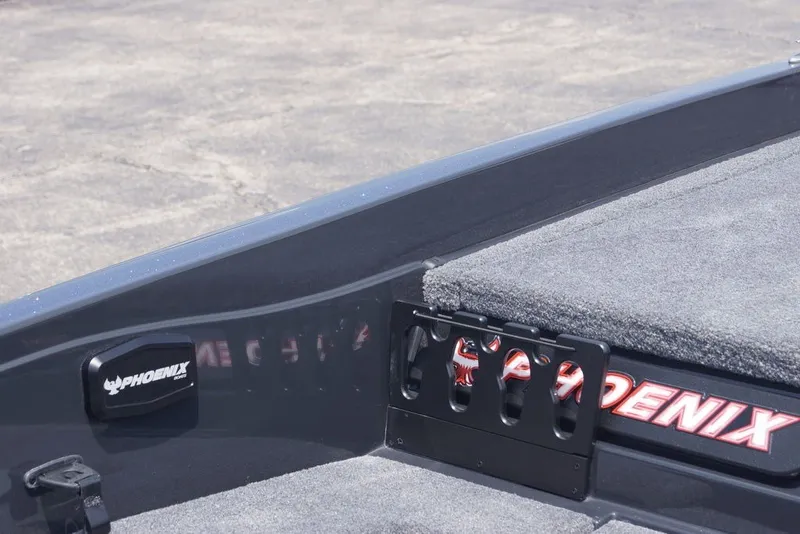 Slide: The Image of 2027 Phoenix 921 Elite X boat deck with logo and rod holder. - 16