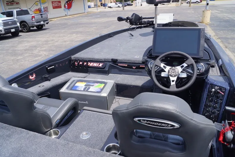 Slide: The Image of Interior of 2027 Phoenix 921 Elite X boat with advanced navigation system and steering wheel. - 7