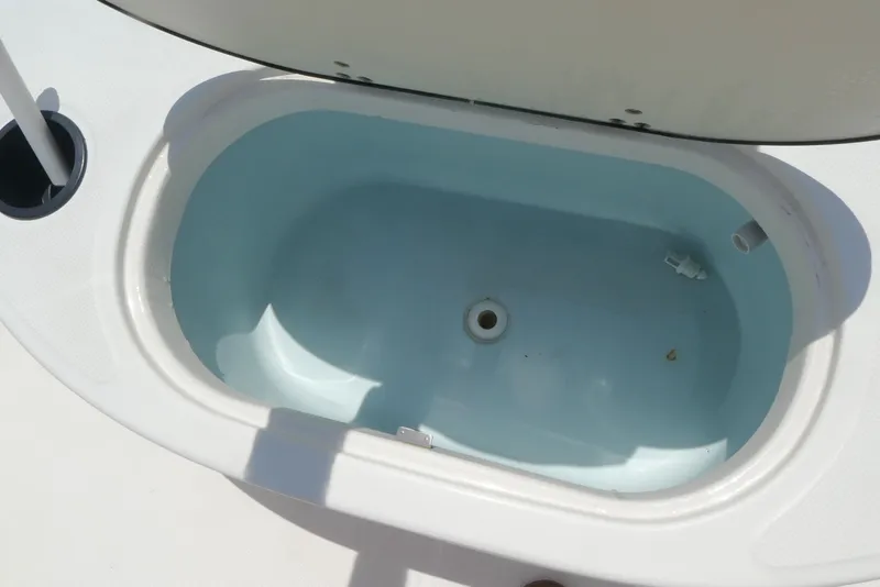Slide: The Image of Livewell on a 2011 Boston Whaler 150 Montauk boat, open and empty. - 7