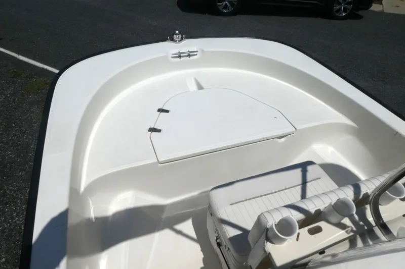 Slide: The Image of 2011 Boston Whaler 150 Montauk boat interior with seating and storage compartment. - 8