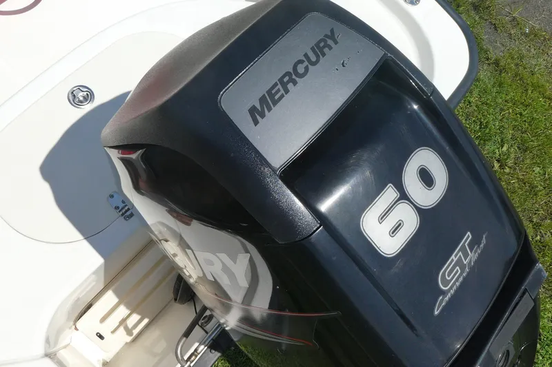 Slide: The Image of Mercury 60 CT outboard motor on a 2011 Boston Whaler 150 Montauk boat. - 4