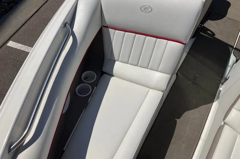Slide: The Image of Interior of a 2003 Cobalt 220 boat with white seating and cup holders. - 8