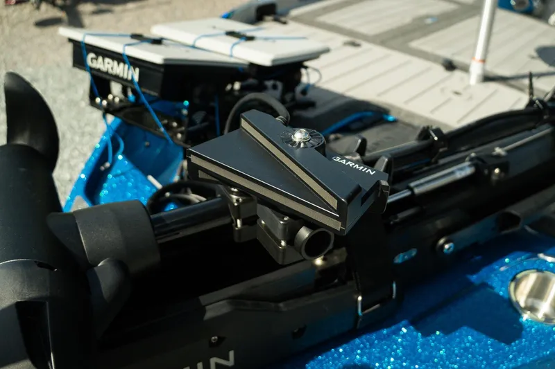 Slide: The Image of 2026 Bass Cat Lynx STS boat featuring Garmin marine electronics on deck. - 26