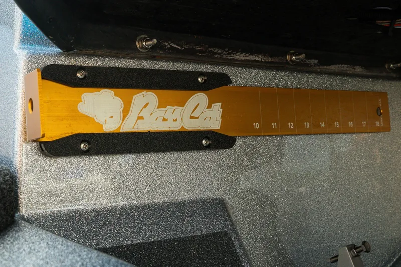 Slide: The Image of 2026 Bass Cat Lynx STS boat ruler with logo and measurement markings. - 16