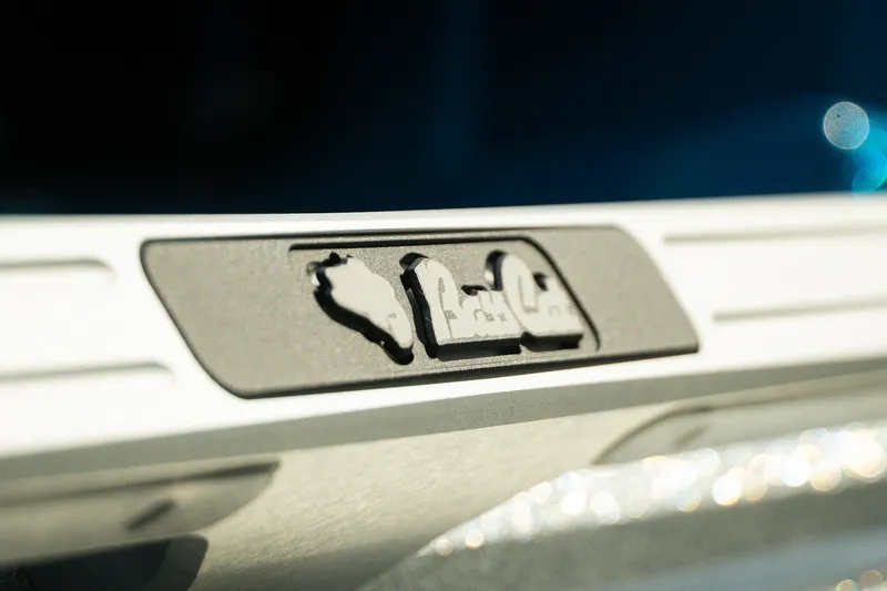 Slide: The Image of Close-up of 2026 Bass Cat Lynx STS boat detail with embossed design. - 25