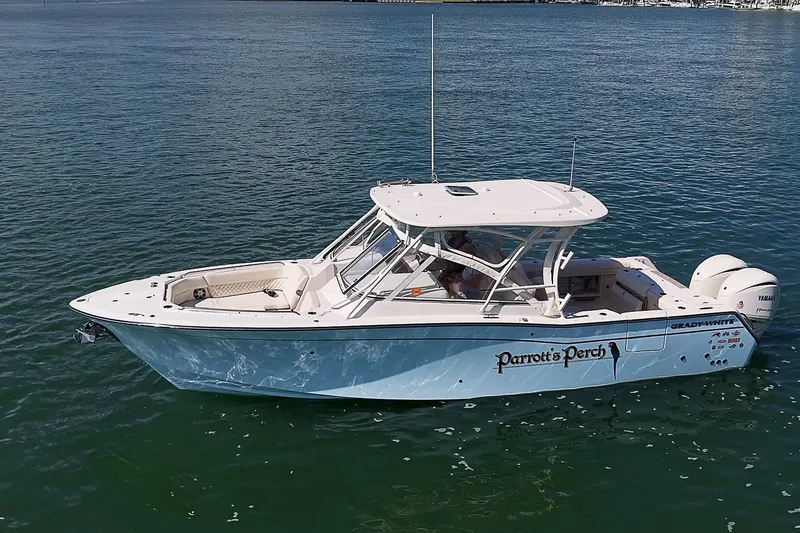 Slide: The Image of 2024 Grady-White Freedom 307 boat on calm water, side view. - 41