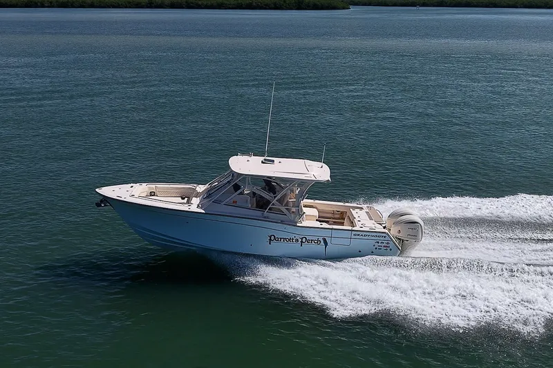 Slide: The Image of 2024 Grady-White Freedom 307 boat cruising on open water, showcasing sleek design and performance. - 52