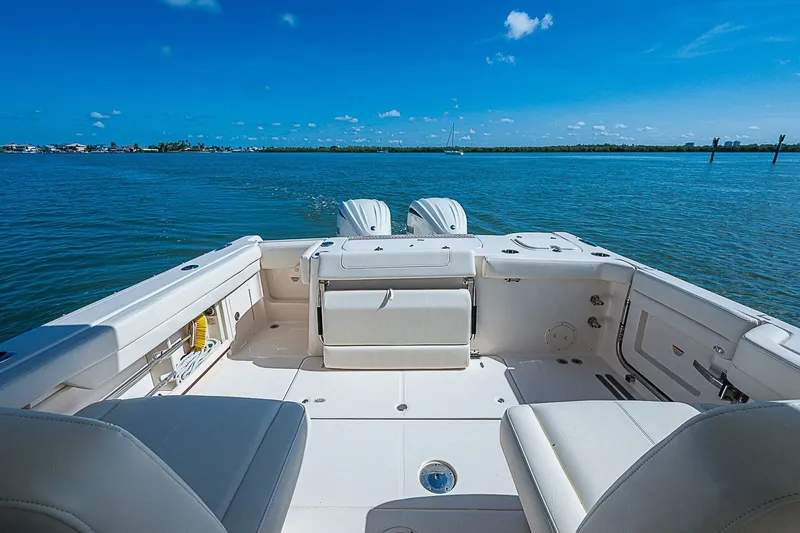 Slide: The Image of 2024 Grady-White Freedom 307 boat interior with ocean view and clear blue sky. - 19