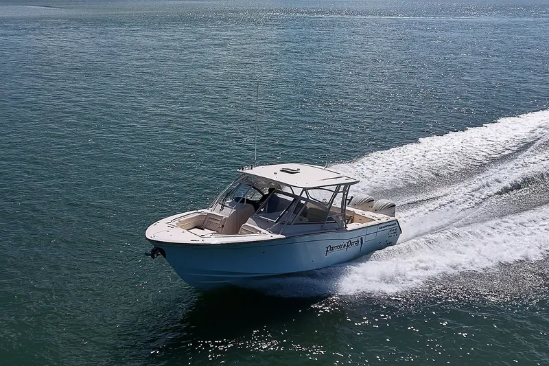 Slide: The Image of 2024 Grady-White Freedom 307 boat cruising on open water. - 56
