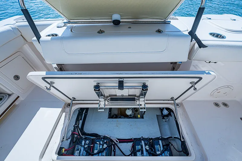 Slide: The Image of 2024 Grady-White Freedom 307 boat battery compartment with open hatch. - 22