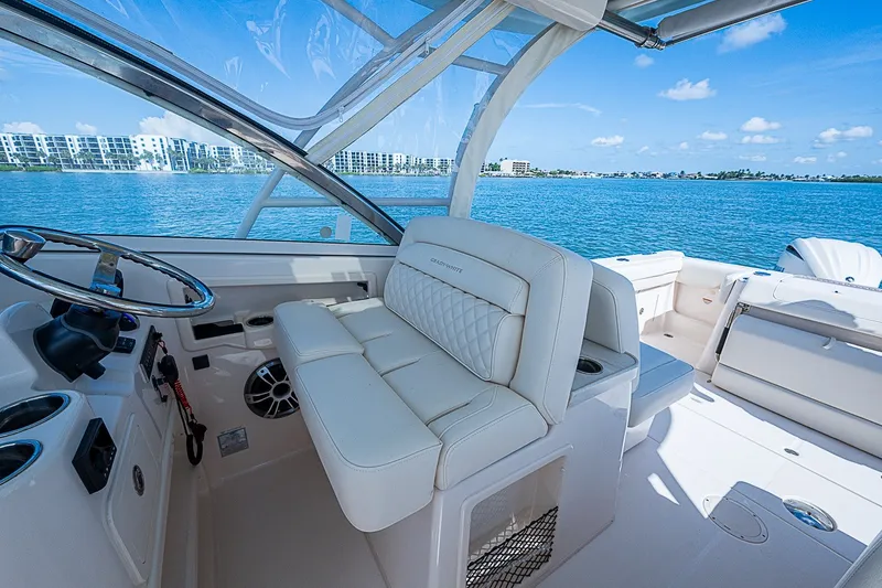 Slide: The Image of 2024 Grady-White Freedom 307 boat interior with luxurious seating and ocean view. - 29