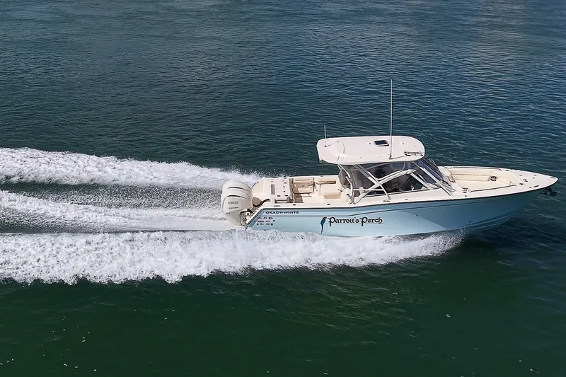 Slide: The Image of 2024 Grady-White Freedom 307 boat cruising on open water, side view. - 57
