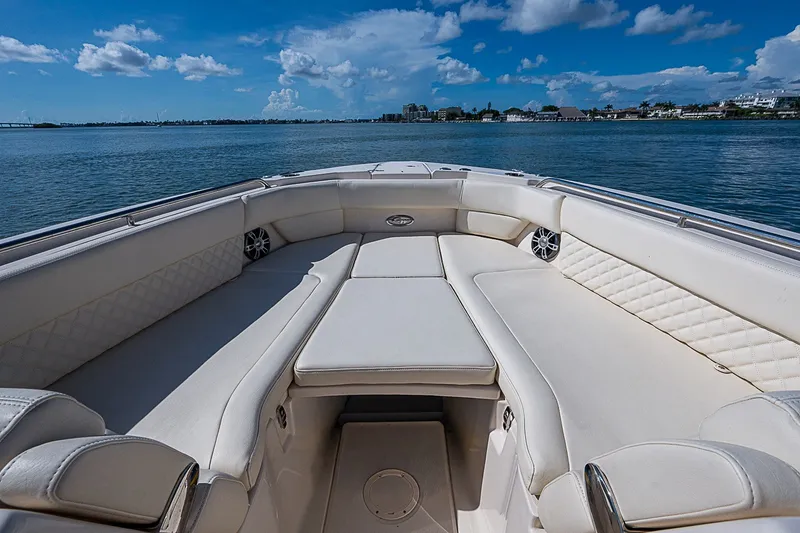 Slide: The Image of 2024 Grady-White Freedom 307 boat interior with luxurious seating and ocean view. - 33