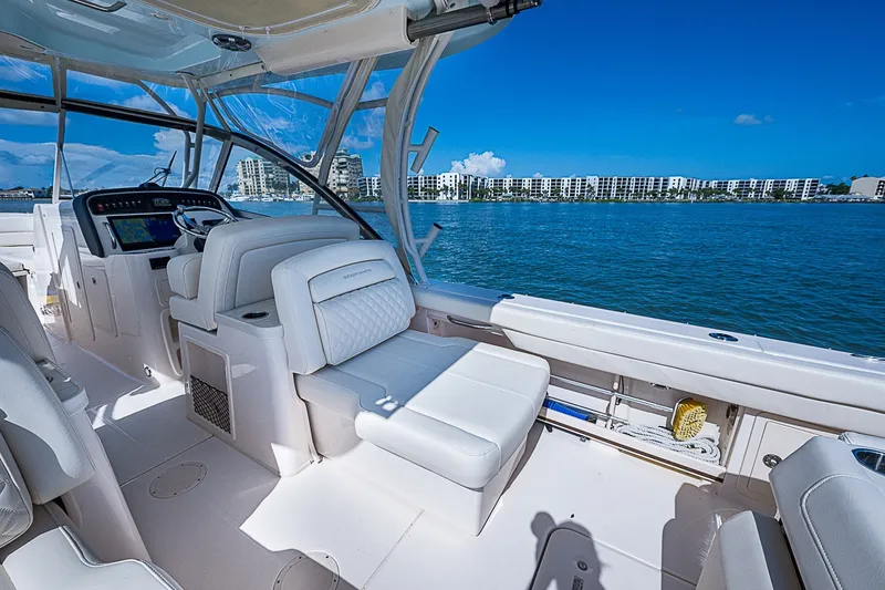 Slide: The Image of 2024 Grady-White Freedom 307 boat interior with luxurious seating and ocean view. - 25
