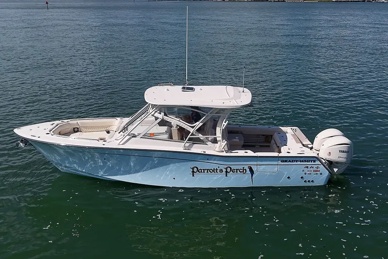Slide: The Image of 2024 Grady-White Freedom 307 boat on calm water, side view. - 42