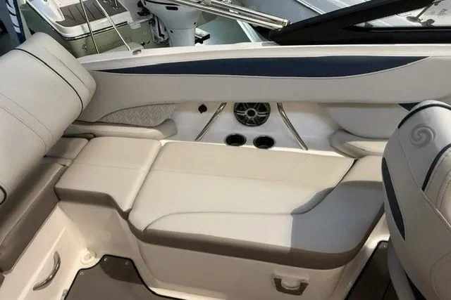 Slide: The Image of 2026 Hurricane SunDeck 2600 OB boat interior with cushioned seating and cup holders. - 15