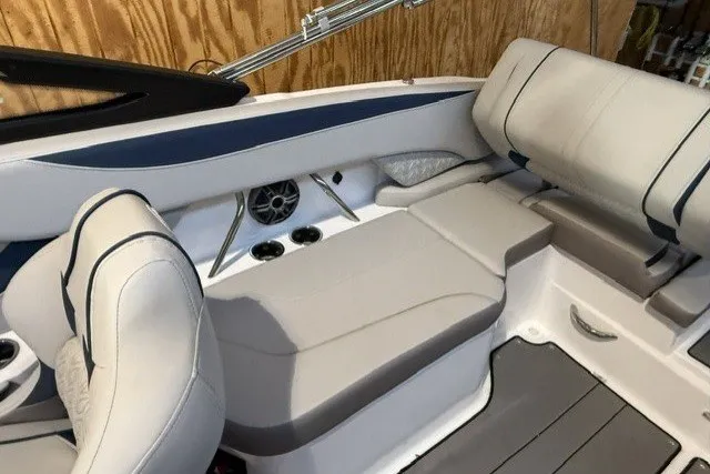 Slide: The Image of 2026 Hurricane SunDeck 2600 OB boat interior with plush seating and modern design. - 16