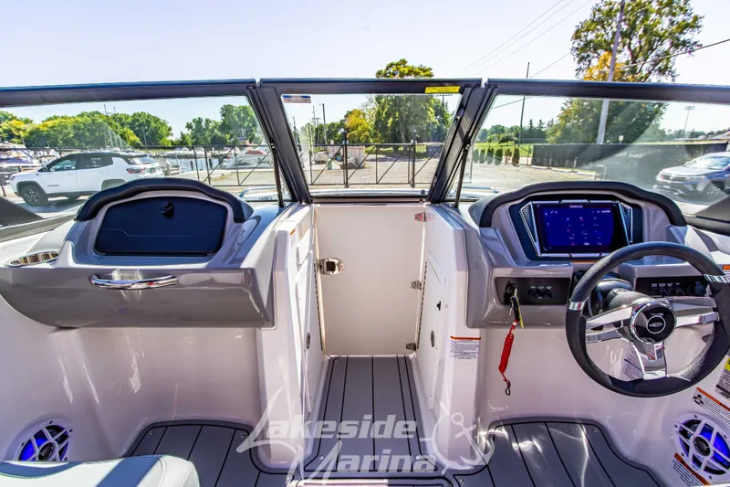 Slide: The Image of 2026 Chaparral 21 SSi OB boat interior with modern dashboard and steering wheel. - 27
