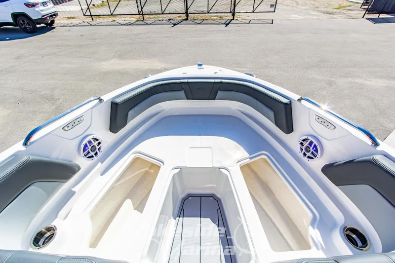 Slide: The Image of Bow seating area of 2026 Chaparral 21 SSi OB boat with speakers and cup holders. - 32
