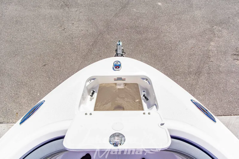 Slide: The Image of Bow view of 2026 Chaparral 21 SSi OB boat, featuring anchor storage compartment. - 33