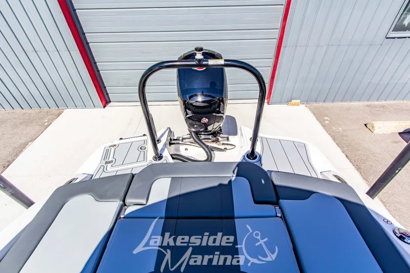 Slide: The Image of 2026 Chaparral 21 SSi OB boat at Lakeside Marina, rear view with outboard motor. - 14