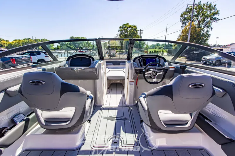 Slide: The Image of Interior view of 2026 Chaparral 21 SSi OB boat, featuring modern seating and dashboard. - 22