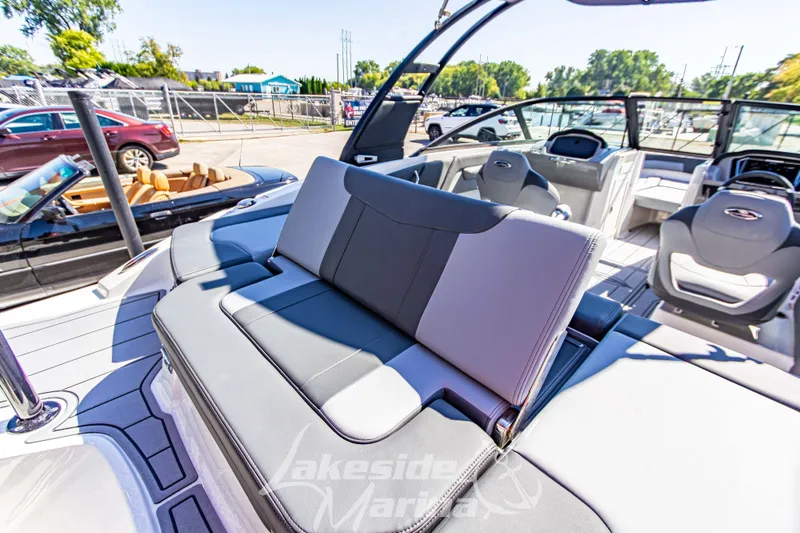 Slide: The Image of 2026 Chaparral 21 SSi OB boat interior with sleek seating at Lakeside Marina. - 13