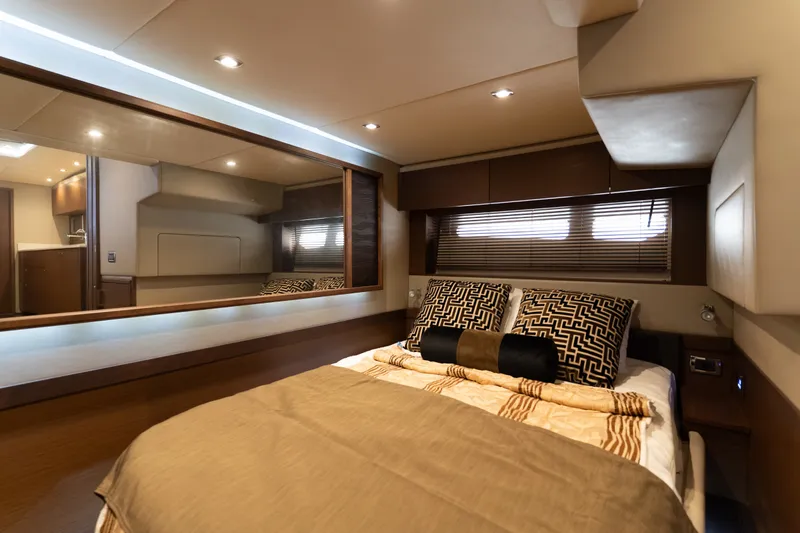 Slide: The Image of Luxurious bedroom interior of 2016 Sea Ray Sundancer 540 yacht with elegant bedding and ambient lighting. - 77