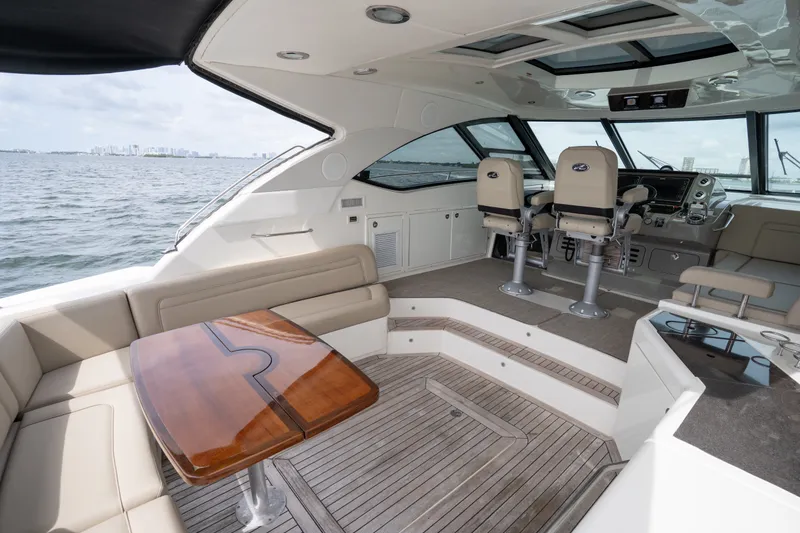 Slide: The Image of Luxurious 2016 Sea Ray Sundancer 540 yacht interior with elegant seating and helm. - 43