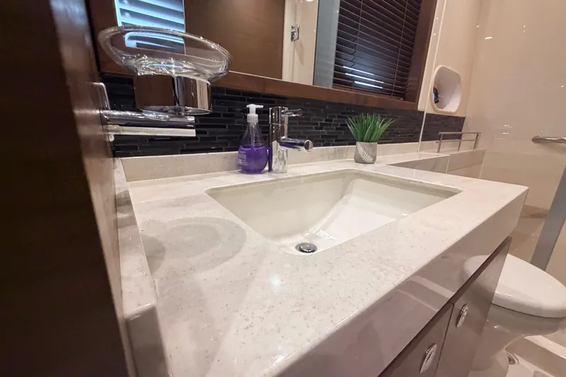 Slide: The Image of Luxurious bathroom sink area in 2016 Sea Ray Sundancer 540 yacht. - 74