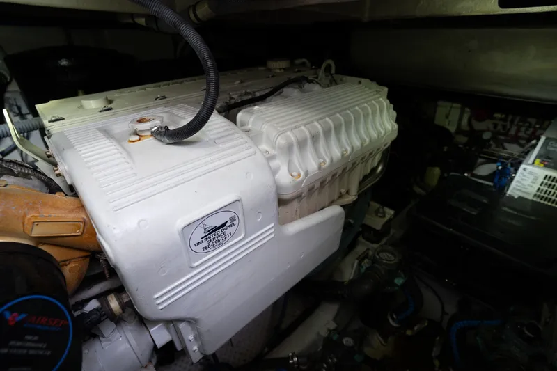 Slide: The Image of Engine compartment of a 2016 Sea Ray Sundancer 540 yacht, showcasing mechanical components. - 91