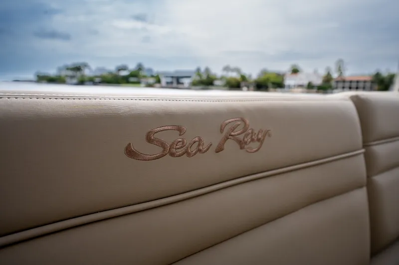Slide: The Image of Close-up of beige upholstery with embroidered "Sea Ray" lettering. - 20